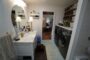 cuarto baño principal Casa 18x56 pies