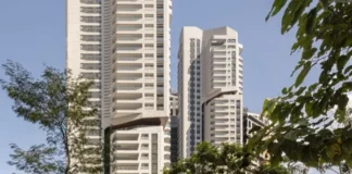 Rascacielos residenciales EZ Parque da Cidade en São Paulo, vistas entre árboles.